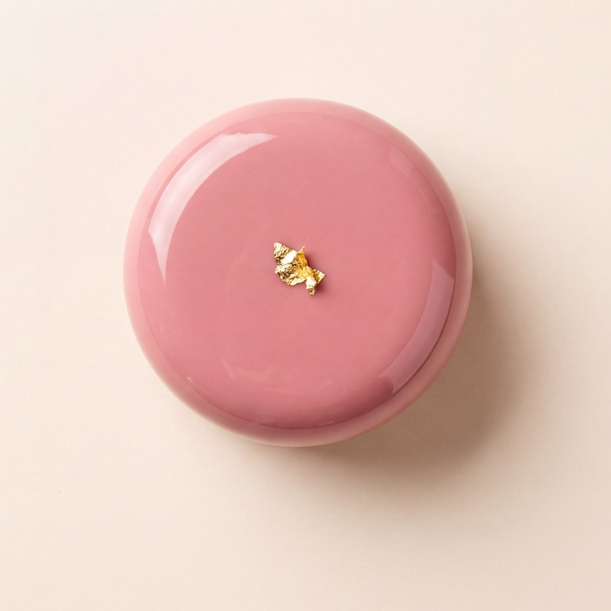 A single raspberry-pink petit gâteau seen from above